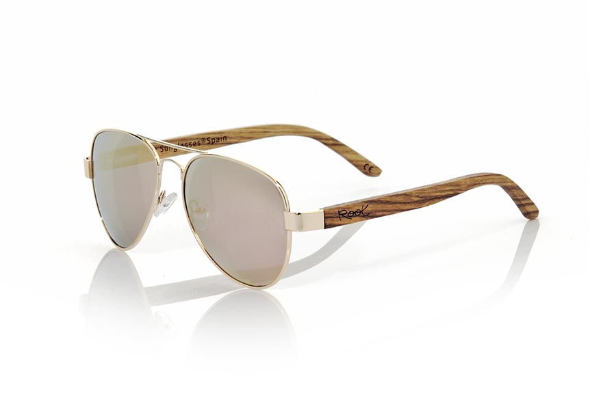 Wood eyewear of Zebrano BERLIN. BERLIN sunglasses are made from the metal frame and sideburns natural Zebrano wood. A classic Aviator style model series combined with yellow lenses REVO, REVO Blue or Gray REVO. You'll love the combination of zebra wood. Front Measure: 150x50mm for Wholesale & Retail | Root Sunglasses® 