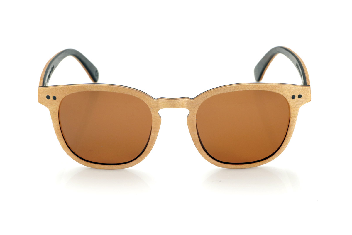 Wood eyewear of Maple MOUTHY. MOUTHY sunglasses are made from a combination of laminated maple wood on the outside and ebony on the inside. Their design balances classic lines with a subtle decorative detail of two dots on the front, highlighting their handcrafted character.

The laminated wood structure enhances strength without compromising lightness, offering comfort for everyday use. The contrast between the natural tone of the maple and the depth of the ebony on the inside provides a refined and distinctive finish.

They incorporate high-quality polarized lenses, which reduce glare and guarantee total UV protection, ensuring clearer and more comfortable vision. A model that fuses tradition and design with natural materials.

Dimensions 142x47mm. Caliber 49 for Wholesale & Retail | Root Sunglasses® 