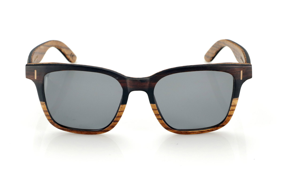 Wood eyewear of mpingo LOREA. LOREA sunglasses are manufactured in a combination of two woods, Mpingo (African Black wood) on top of the frame and on the outside of the temples and Zebrano on the bottom of the frame and inside of the temples. It is a simple and elegant easy-to-wear model with a very careful finish that will surprise you with its originality and the combination of woods. Front measurement: 145x50mm for Wholesale & Retail | Root Sunglasses® 