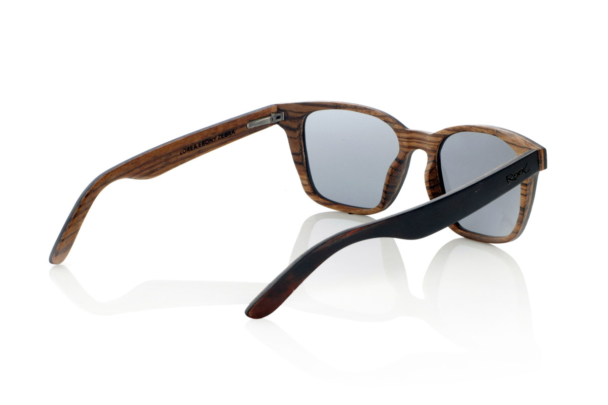 Wood eyewear of mpingo LOREA. LOREA sunglasses are manufactured in a combination of two woods, Mpingo (African Black wood) on top of the frame and on the outside of the temples and Zebrano on the bottom of the frame and inside of the temples. It is a simple and elegant easy-to-wear model with a very careful finish that will surprise you with its originality and the combination of woods. Front measurement: 145x50mm for Wholesale & Retail | Root Sunglasses® 